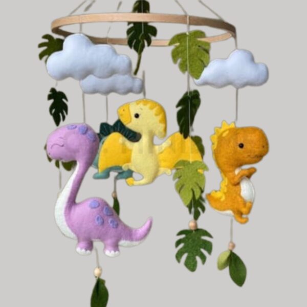 Colgante para cuna con diseño de dinosaurios