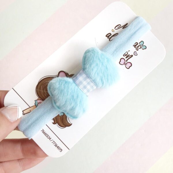 Vincha para bebé con corbata de pelusa celeste